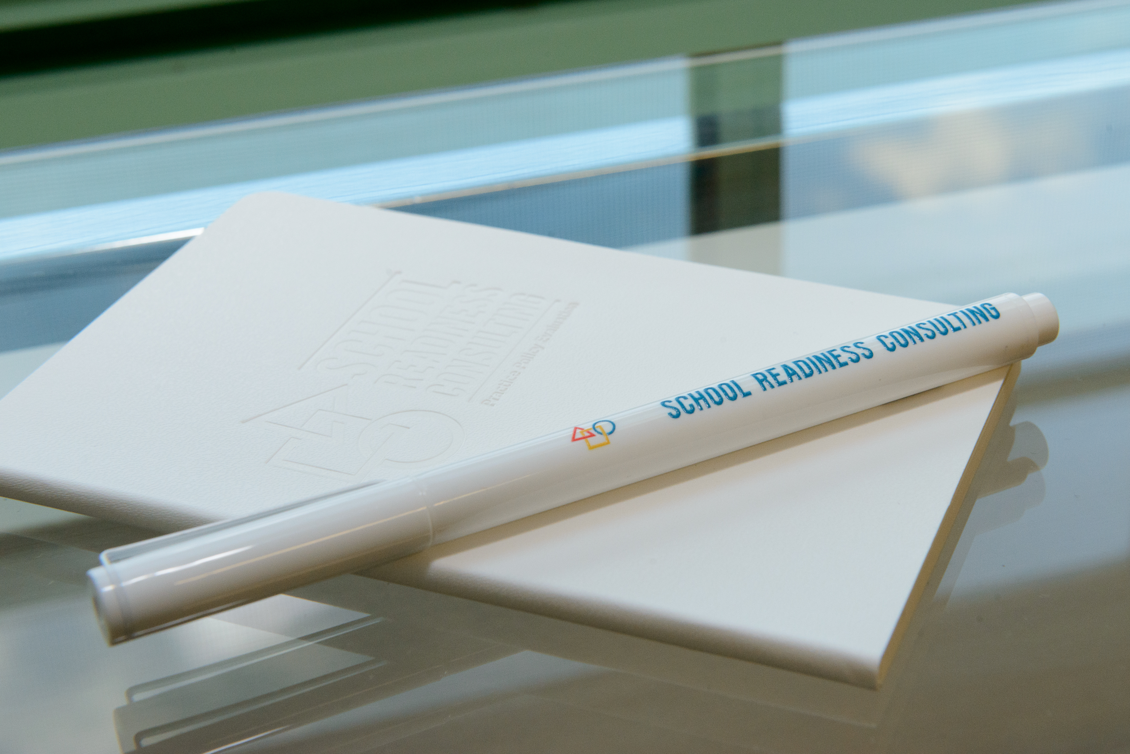 Branded Giveaways from School Readiness Consulting's Open House included branded pens and branded moleskine notebooks